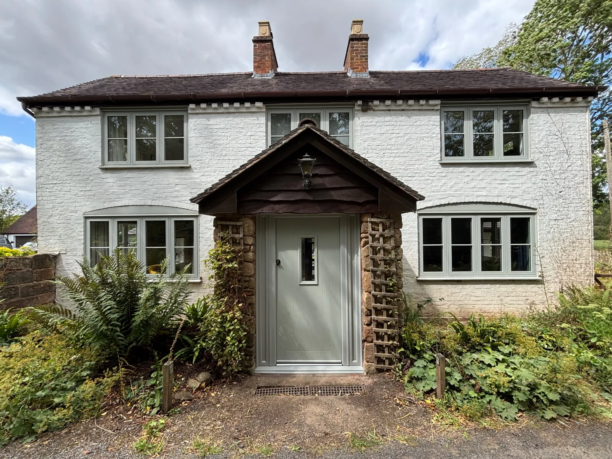 Front of the Bridgnorth cottage with new Agate Grey uPVC windows and front door