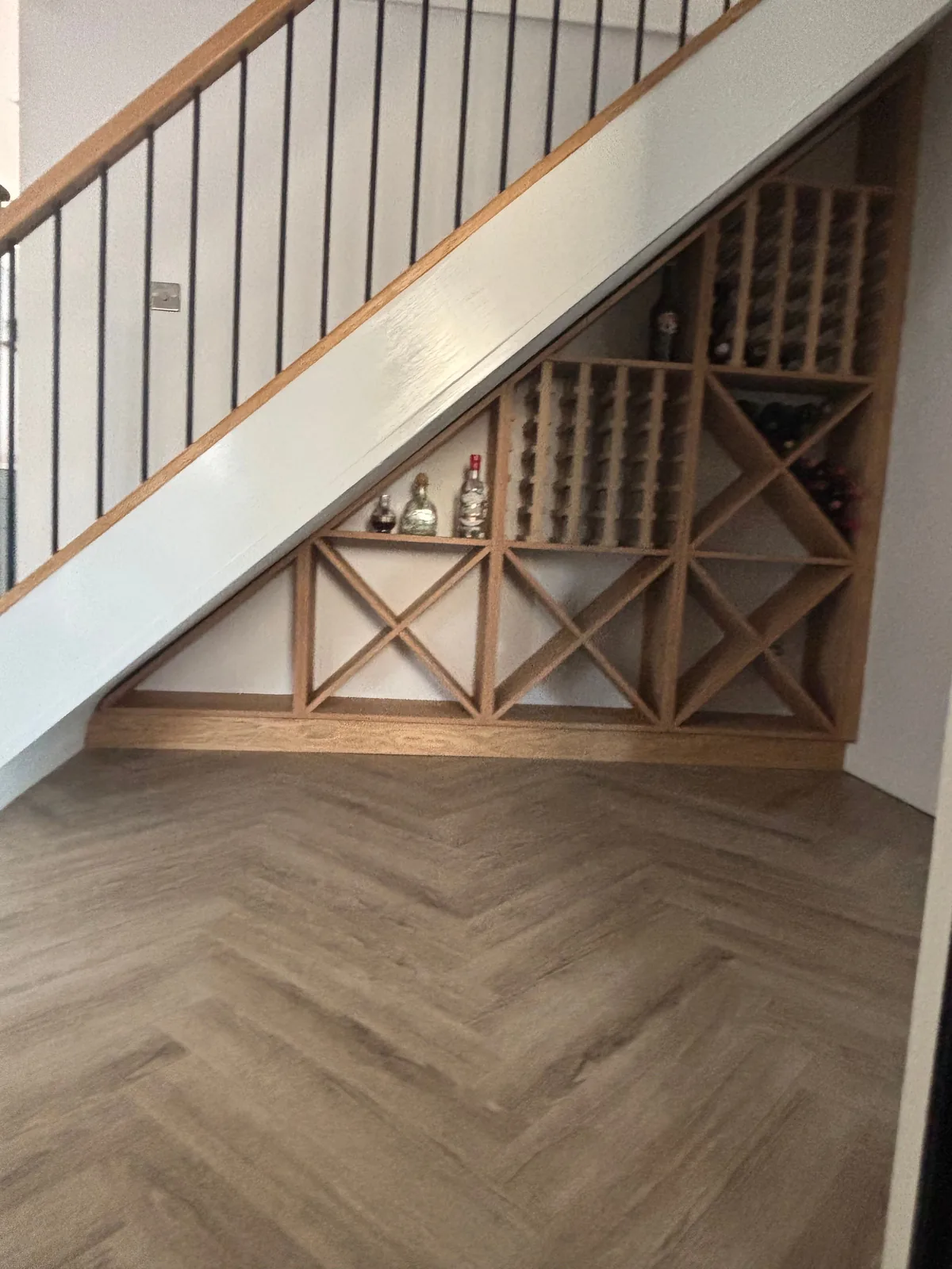 Before: the under-stairs wine store, open to the hall, before replacement by Heritage Windows and Doors in the West Midlands
