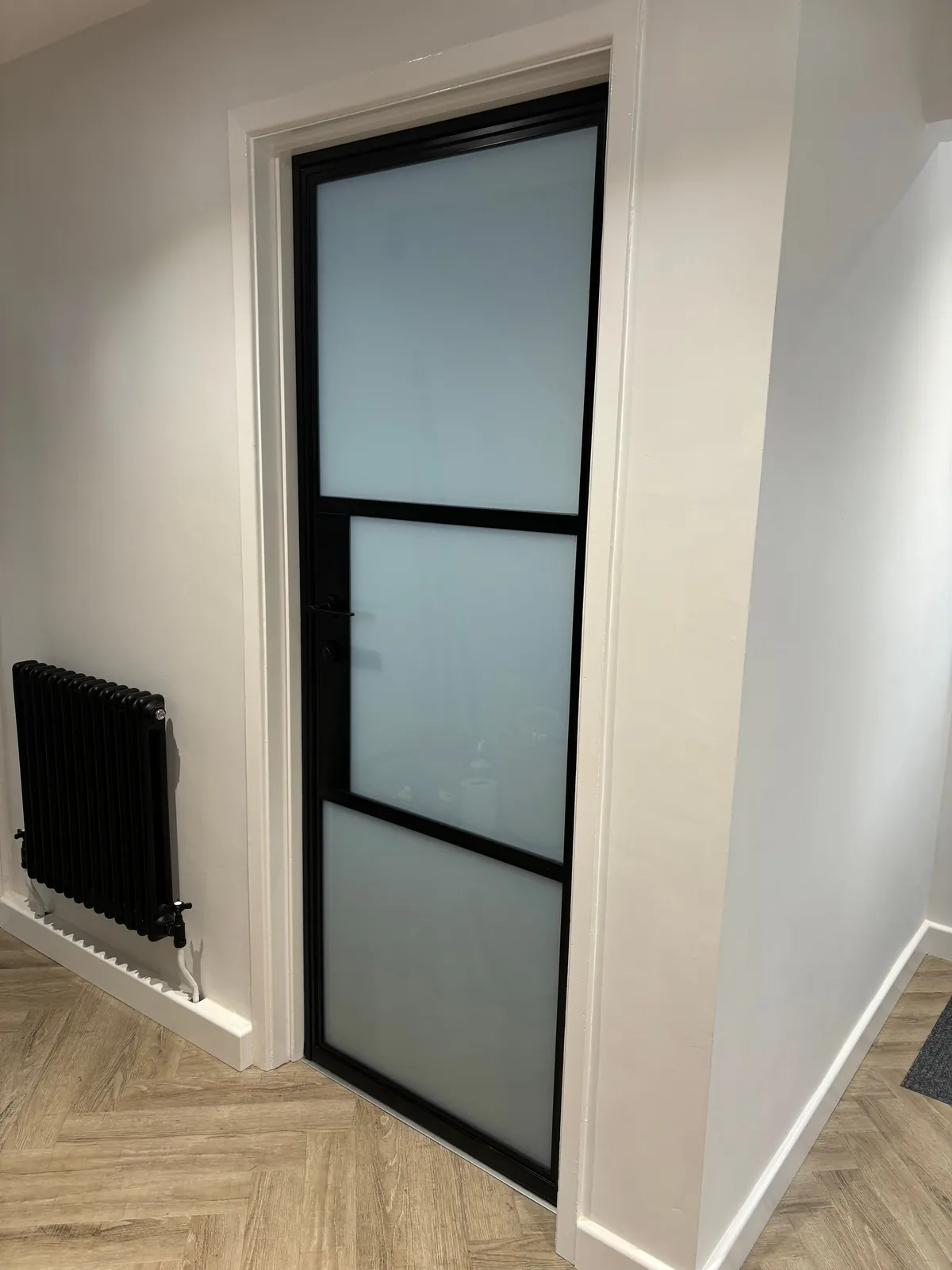 After: the same doorway with a frosted aluminium door, by Heritage Windows and Doors in the West Midlands