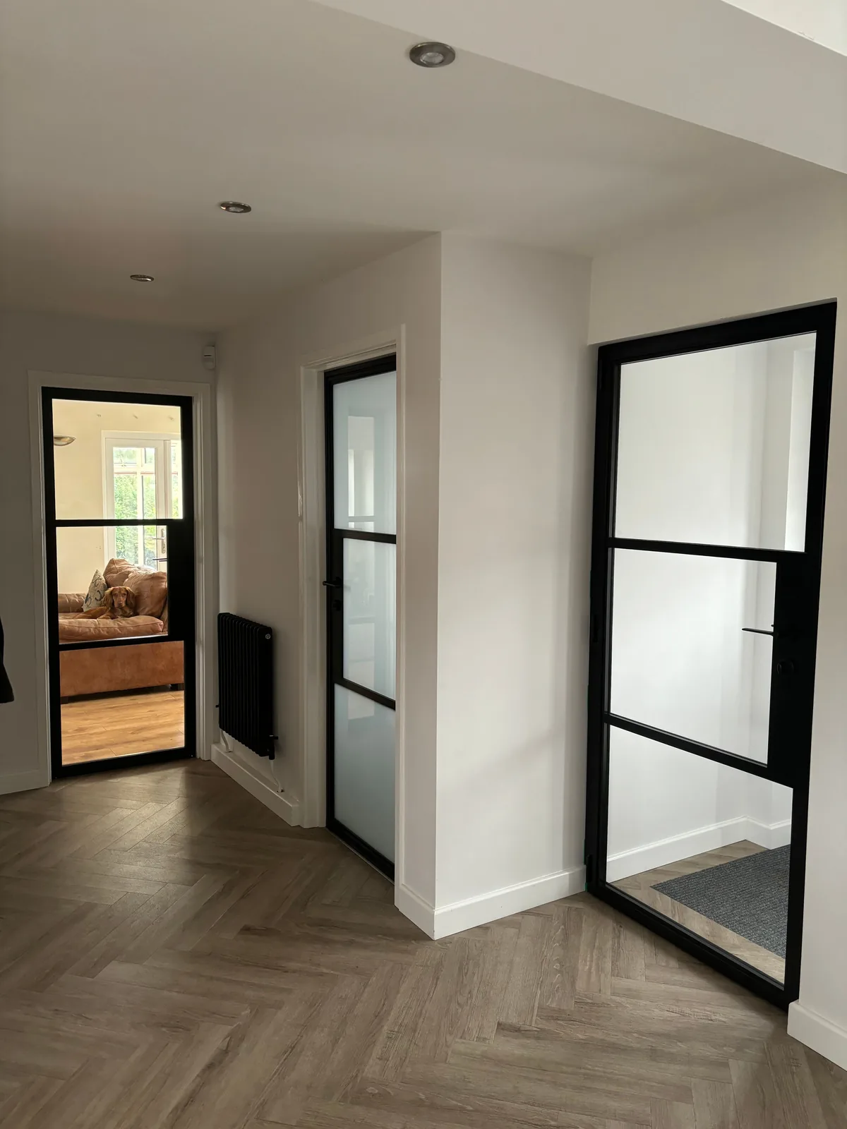 Three internal aluminium doors off one hallway, by Heritage Windows and Doors in the West Midlands