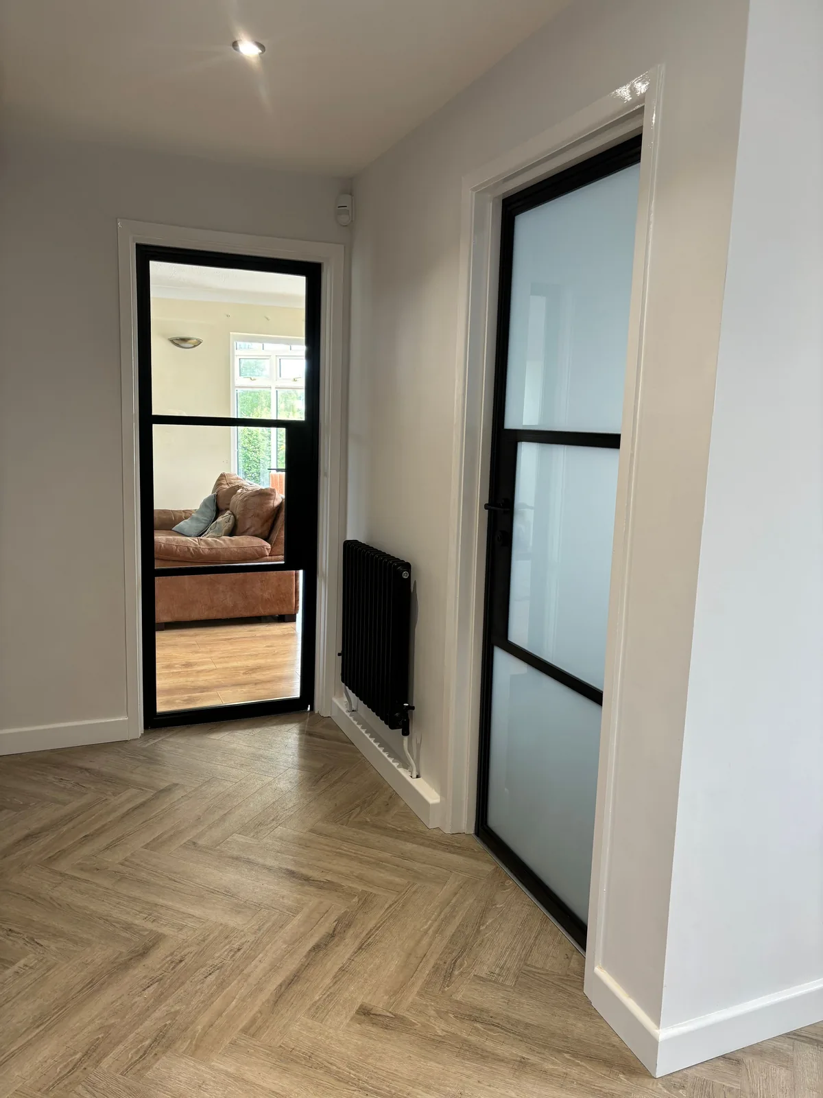 Clear and frosted doors in the same hallway, by Heritage Windows and Doors in the West Midlands